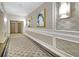 Carpeted hallway with patterned wallpaper, elegant art and lighting at 195 14Th St # 902, Atlanta, GA 30309