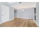 Living room with hardwood floors leading into kitchen area at 195 14Th St # 902, Atlanta, GA 30309