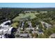 Aerial view of the complex, golf course, and surrounding wooded area at 211 Colonial Homes Nw Dr # 2501, Atlanta, GA 30309