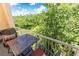 Balcony seating with a distant forest backdrop at 211 Colonial Homes Nw Dr # 2501, Atlanta, GA 30309