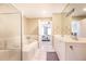 Bathroom featuring a double sink vanity, soaking tub, and glass shower at 211 Colonial Homes Nw Dr # 2501, Atlanta, GA 30309