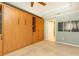 A spacious bedroom with a large cabinet system and views into the hallway at 211 Colonial Homes Nw Dr # 2501, Atlanta, GA 30309