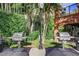 Outdoor grilling area featuring two stainless steel grills and lush landscaping at 211 Colonial Homes Nw Dr # 2501, Atlanta, GA 30309