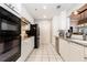 Well-lit kitchen featuring white cabinets, stainless steel appliances, and granite countertops at 211 Colonial Homes Nw Dr # 2501, Atlanta, GA 30309