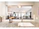 Open kitchen featuring granite countertops and stainless steel faucet with a seamless view to the living room at 211 Colonial Homes Nw Dr # 2501, Atlanta, GA 30309