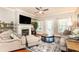 Living room featuring a fireplace, neutral paint, access to the outdoor area at 211 Colonial Homes Nw Dr # 2501, Atlanta, GA 30309