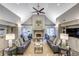 Inviting living room with a fireplace, vaulted ceiling, and modern decor at 211 Colonial Homes Nw Dr # 2501, Atlanta, GA 30309