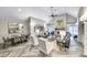 Spacious living room with a fireplace, modern decor, and herringbone-patterned flooring at 211 Colonial Homes Nw Dr # 2501, Atlanta, GA 30309