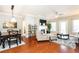 Inviting living room featuring hardwood floors, a fireplace, modern furnishings, and bright natural light at 211 Colonial Homes Nw Dr # 2501, Atlanta, GA 30309