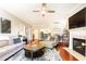 Cozy living room showcasing hardwood floors, a fireplace, neutral decor, and an open concept layout at 211 Colonial Homes Nw Dr # 2501, Atlanta, GA 30309