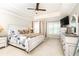 Bright main bedroom with tray ceiling, fan, and neutral decor at 211 Colonial Homes Nw Dr # 2501, Atlanta, GA 30309