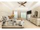 Main bedroom boasting a tray ceiling, fan, and comfortable furnishings at 211 Colonial Homes Nw Dr # 2501, Atlanta, GA 30309