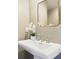 The bathroom vanity features a framed mirror and a floral accent at 345 Alderwood Ln, Sandy Springs, GA 30328