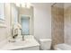 Bathroom featuring modern fixtures, white vanity, and tiled shower/tub at 345 Alderwood Ln, Sandy Springs, GA 30328
