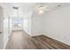Spacious bedroom with wood floors, neutral paint, ceiling fan, and plenty of natural light from large window at 345 Alderwood Ln, Sandy Springs, GA 30328