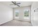 Bedroom with carpet, white trim, and two windows at 345 Alderwood Ln, Sandy Springs, GA 30328