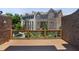 Wooden deck overlooks a well-manicured lawn and townhouse exteriors at 345 Alderwood Ln, Sandy Springs, GA 30328