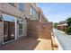 An inviting outdoor patio boasts a wooden deck and brick privacy wall at 345 Alderwood Ln, Sandy Springs, GA 30328