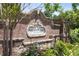 Community sign for Alderwood on Abernathy, set in brick and stone landscaping at 345 Alderwood Ln, Sandy Springs, GA 30328