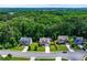 Neighborhood aerial view showing tree-lined street, well-manicured lawns, and traditional two-story homes at 350 Paces Dr, Lithia Springs, GA 30122