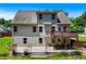 Backyard view featuring a deck, patio, fenced yard, and mature landscaping at 350 Paces Dr, Lithia Springs, GA 30122