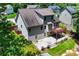 Aerial view of backyard with a deck, patio, and mature trees at 350 Paces Dr, Lithia Springs, GA 30122