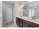 Modern bathroom featuring double sink vanity, marble countertops, and large mirror at 350 Paces Dr, Lithia Springs, GA 30122