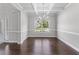 Bright dining room features hardwood floors, classic wainscoting, and elegant chandelier at 350 Paces Dr, Lithia Springs, GA 30122