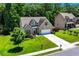 Charming brick and siding home with a well-maintained lawn, landscaping, and an attached two-car garage at 350 Paces Dr, Lithia Springs, GA 30122