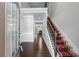 Welcoming foyer with hardwood floors, staircase, and views into the living areas at 350 Paces Dr, Lithia Springs, GA 30122