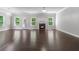 Bright living area with fireplace, hardwood floors, and large windows offering outdoor views at 350 Paces Dr, Lithia Springs, GA 30122