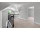 The loft features wrought iron railing, neutral carpet and walls, plus contemporary pendant lights at 350 Paces Dr, Lithia Springs, GA 30122
