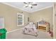 This bedroom features carpet, a ceiling fan, and a twin bed at 827 Fraser Se St, Atlanta, GA 30315