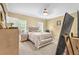 Comfortable bedroom featuring neutral colors, plush carpeting, and natural light from a window at 827 Fraser Se St, Atlanta, GA 30315