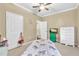 This bedroom features carpet, a ceiling fan, and a twin bed at 827 Fraser Se St, Atlanta, GA 30315