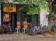 Exterior view of 'Loose Nuts Cycles' bike shop with bikes displayed outside at 827 Fraser Se St, Atlanta, GA 30315