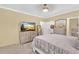 This spacious main bedroom features carpet, a ceiling fan, television, and an ensuite bathroom at 827 Fraser Se St, Atlanta, GA 30315