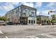 View of Summerhill buildings with colorful murals and street activity on a bright day at 827 Fraser Se St, Atlanta, GA 30315