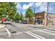 Street view with Little Bear building and colorful murals, showcasing neighborhood charm at 827 Fraser Se St, Atlanta, GA 30315