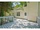 Exterior of home with large backyard deck, ideal for outdoor gatherings at 3524 Forest Downs Cv, Decatur, GA 30034