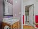Charming powder room featuring a pedestal sink and adjacent laundry room at 3524 Forest Downs Cv, Decatur, GA 30034