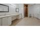 Bathroom featuring double vanities and a shower at 3524 Forest Downs Cv, Decatur, GA 30034