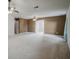 Spacious carpeted bedroom with dual ceiling fans and access to an en-suite bathroom at 3524 Forest Downs Cv, Decatur, GA 30034