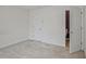 Carpeted bedroom with an open doorway to an adjacent room at 3524 Forest Downs Cv, Decatur, GA 30034