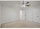 Bedroom with neutral carpet, closet, and ceiling fan at 3524 Forest Downs Cv, Decatur, GA 30034