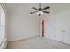 Bright bedroom with ceiling fan and double door closet at 3524 Forest Downs Cv, Decatur, GA 30034