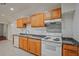 Traditional kitchen features wood cabinets and laminate counters at 3524 Forest Downs Cv, Decatur, GA 30034