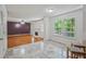 Open-concept living room with hardwood floors and abundant natural light from large windows at 3524 Forest Downs Cv, Decatur, GA 30034