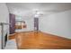 Open layout of the living room featuring a fireplace and an adjacent eat-in kitchen at 3524 Forest Downs Cv, Decatur, GA 30034