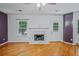 Cozy living room with fireplace and hardwood floors and a glass door to outside at 3524 Forest Downs Cv, Decatur, GA 30034